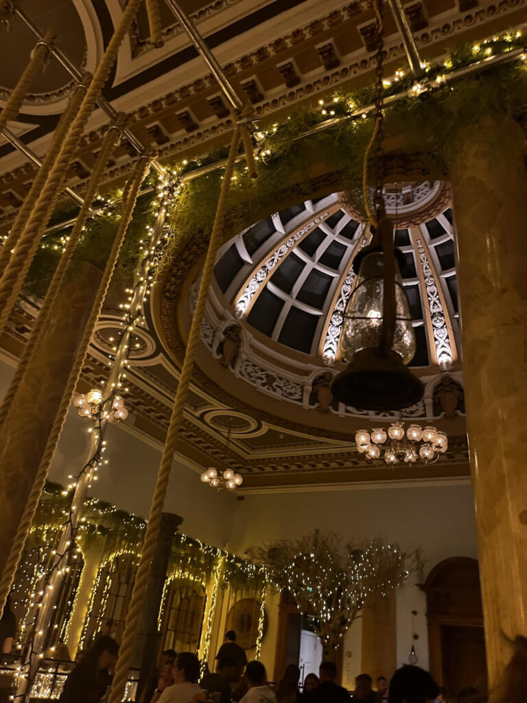 Inside a Mowgli Indian restaurant. Decorative lights and rope swings throughout the premises.