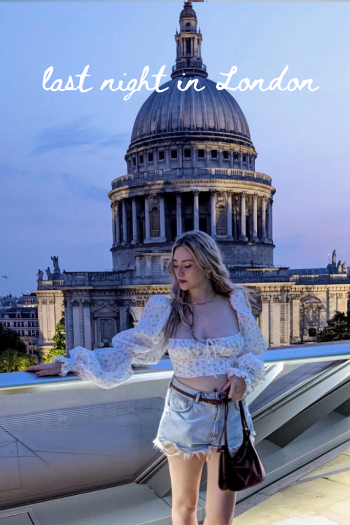 woman on terrace in London with St Pauls Cathedral in the evening light