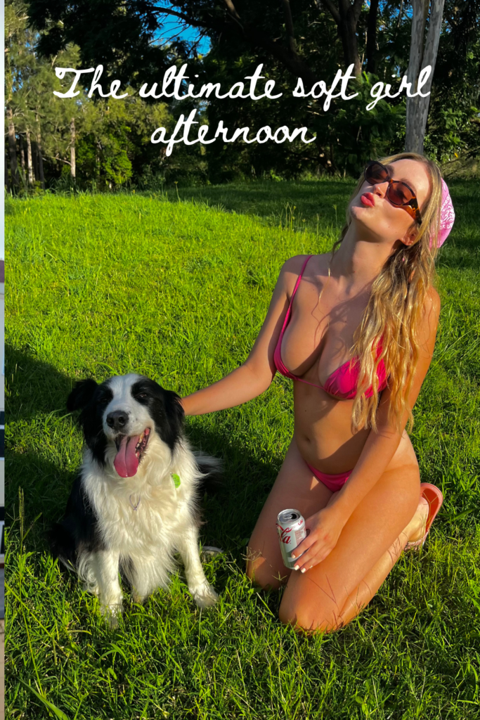 woman sat on grass in pink bikini with a border collie 