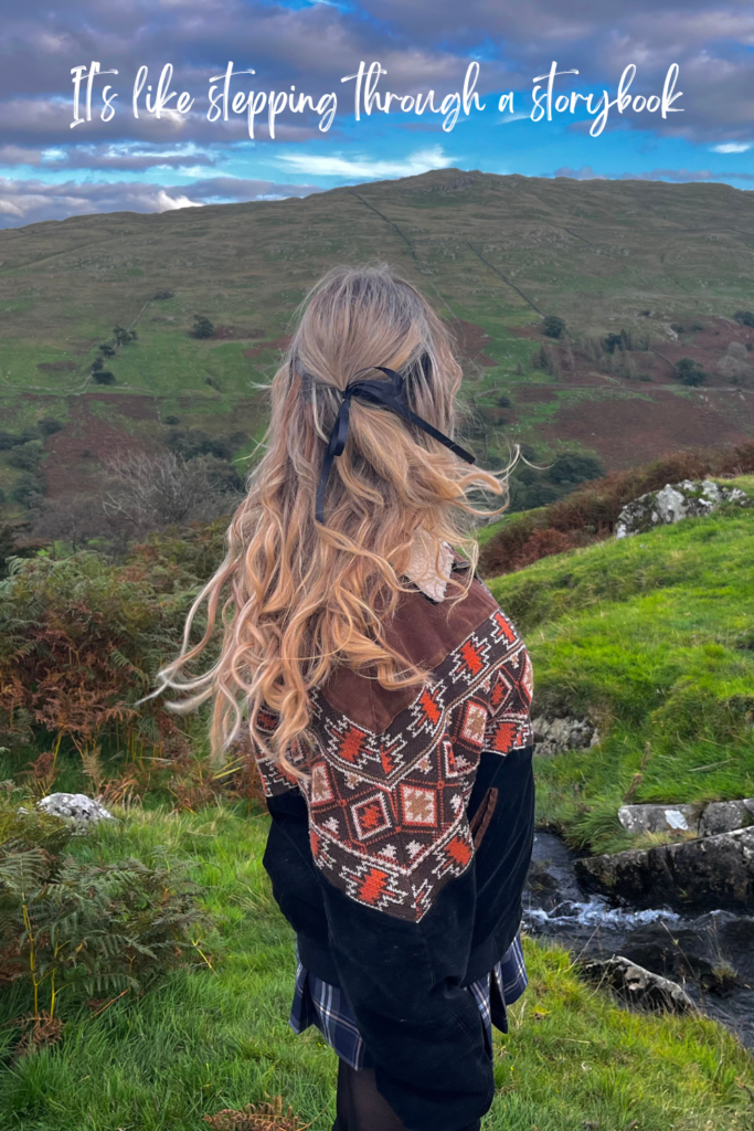 woman in autumn jacket in lake district hills in autumn