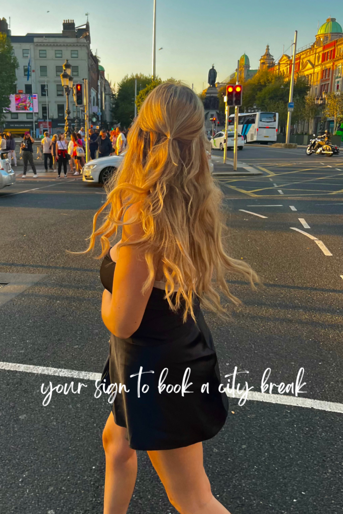 blonde woman in black at golden hour on the streets of Dublin