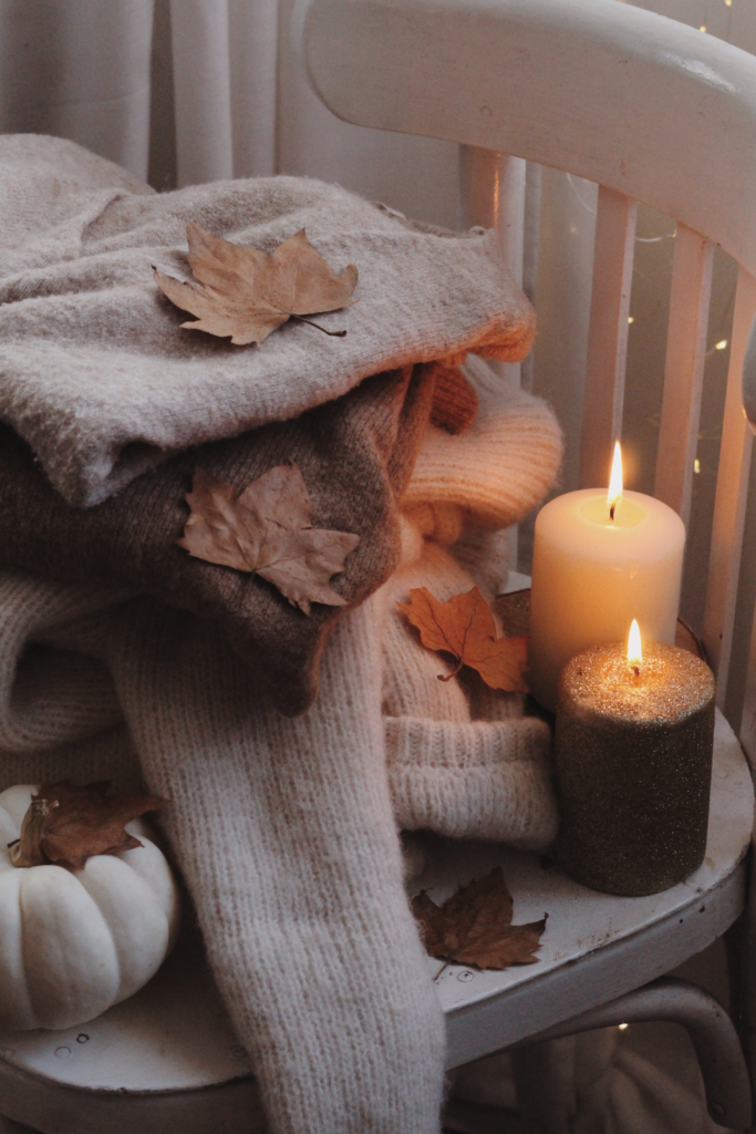 fall sweaters with candles 